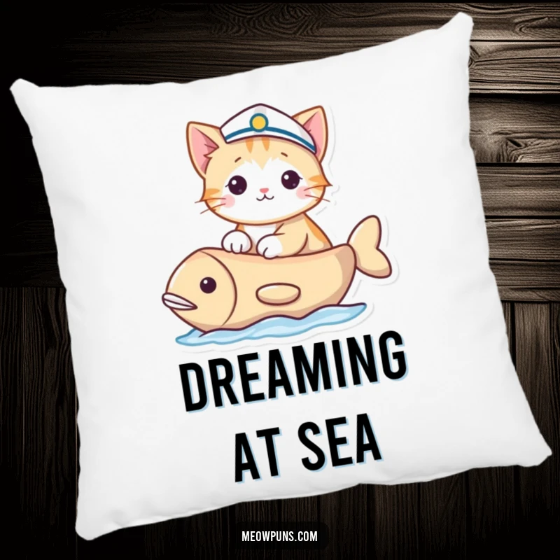 Funny pillow design of a cat in a sailor hat sailing a fish-shaped boat, offering comfortable and humorous nautical decor.