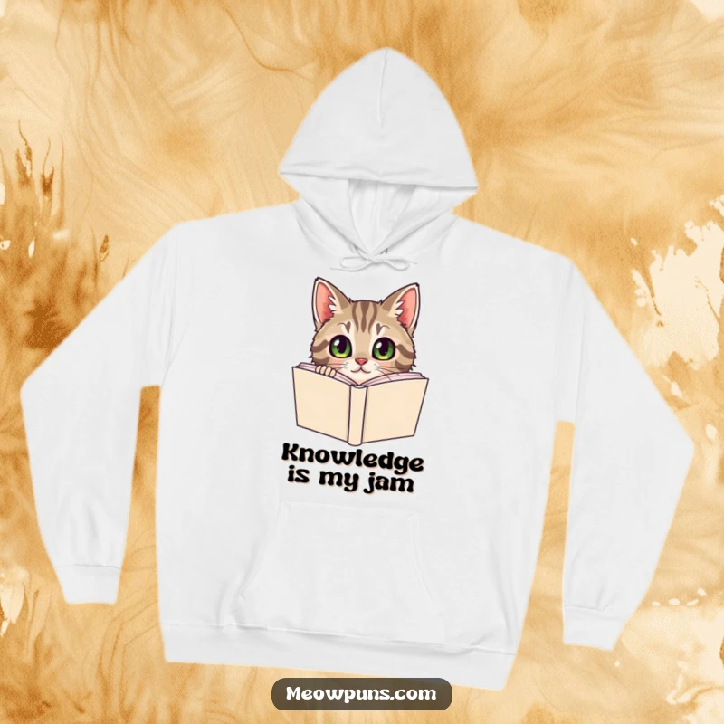 Funny Tabby Cat Hoodie, a curious tabby cat peeks from behind a dictionary, offering warm, literary humor.