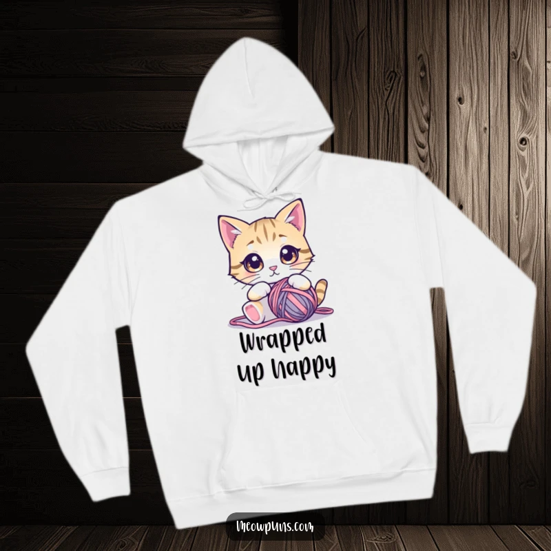 Funny cat hoodie featuring a cute cat with wide, mesmerized eyes staring intently at a tempting ball of yarn.