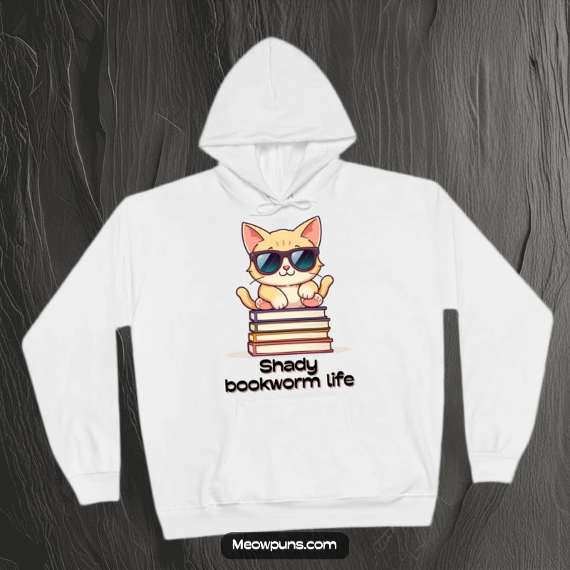Funny hoodie with a cool cat wearing sunglasses, relaxed on books, offering cozy and stylish vibes.