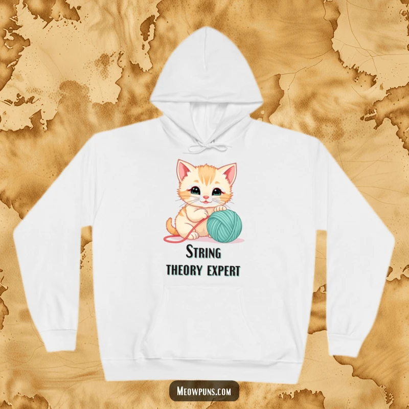 Funny hoodie with a cute kitten playfully attacking a ball of yarn, perfect for cozy days and cat lovers.