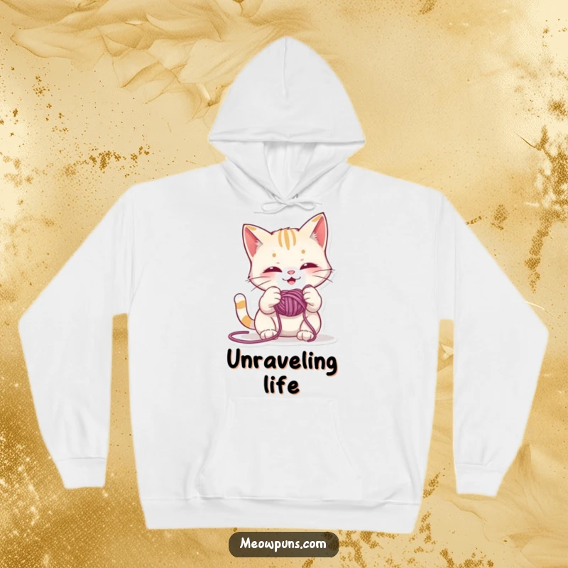 Funny hoodie illustration of a mischievous cat enthusiastically playing with a large ball of yarn, creating a humorous and cozy feel.