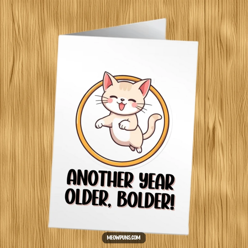 Funny Free Printable Birthday Card: Cat impressively leaping through a giant stylized M hoop with joy.