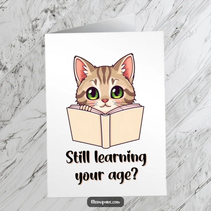 Funny Free Printable Birthday Card: Curious tabby cat peeking with wide eyes from behind a large dictionary.