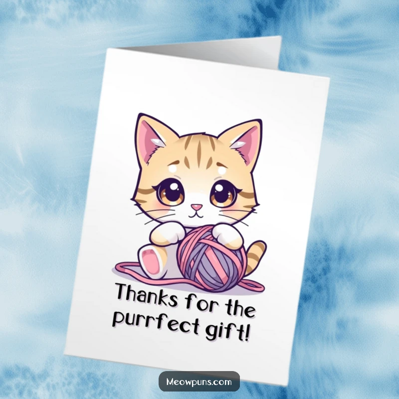 Funny Free Printable Thank You Card: A cat with large, mesmerized eyes gazing lovingly at a big ball of colorful yarn, showing thanks.