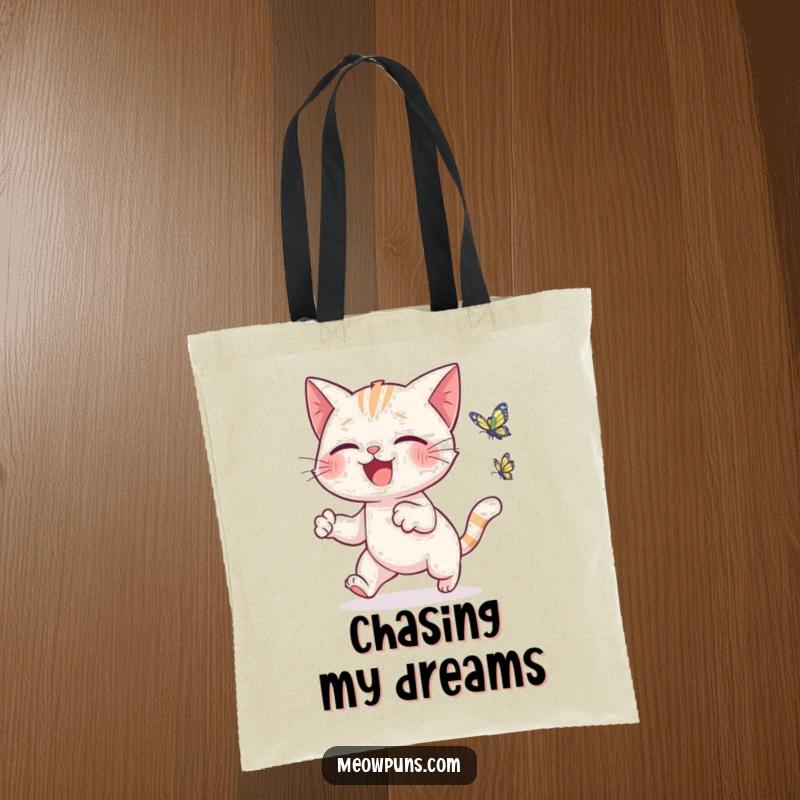 Funny cat tote bag with a cute cat joyfully chasing a tiny, fluttering butterfly, ideal for errands and shopping.