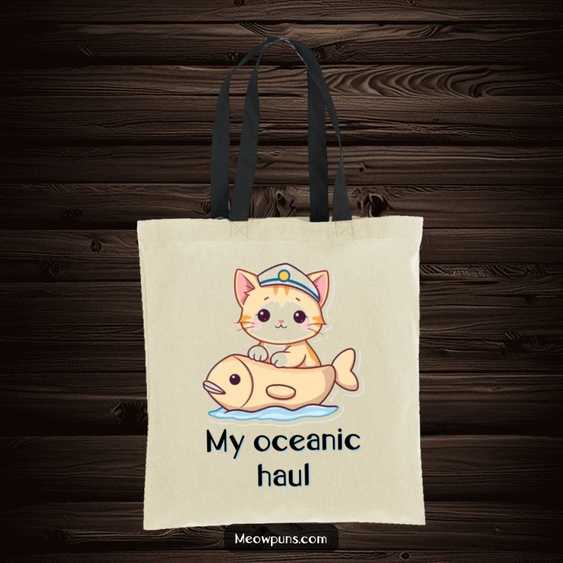 Funny tote bag showing a cat in a sailor hat sailing a fish-shaped boat, perfect for carrying items with nautical humor.